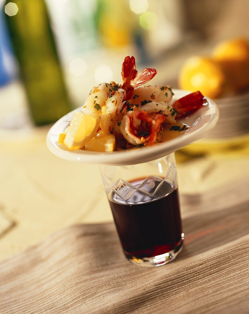 Shrimp Tapas on a Glass of Red Wine