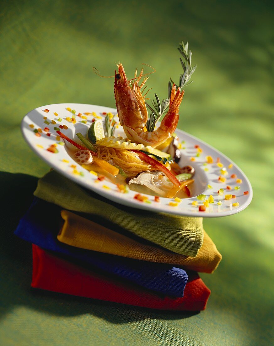 Shrimp with Vegetables and Pasta in Broth on a Pile of Napkins