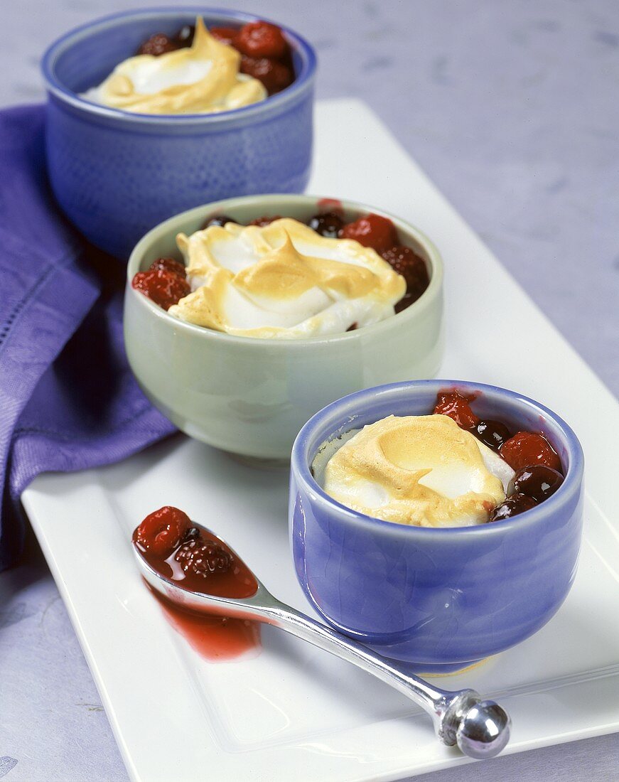 Mixed Berries Baked with a Meringue Topping in Individual Ramekins