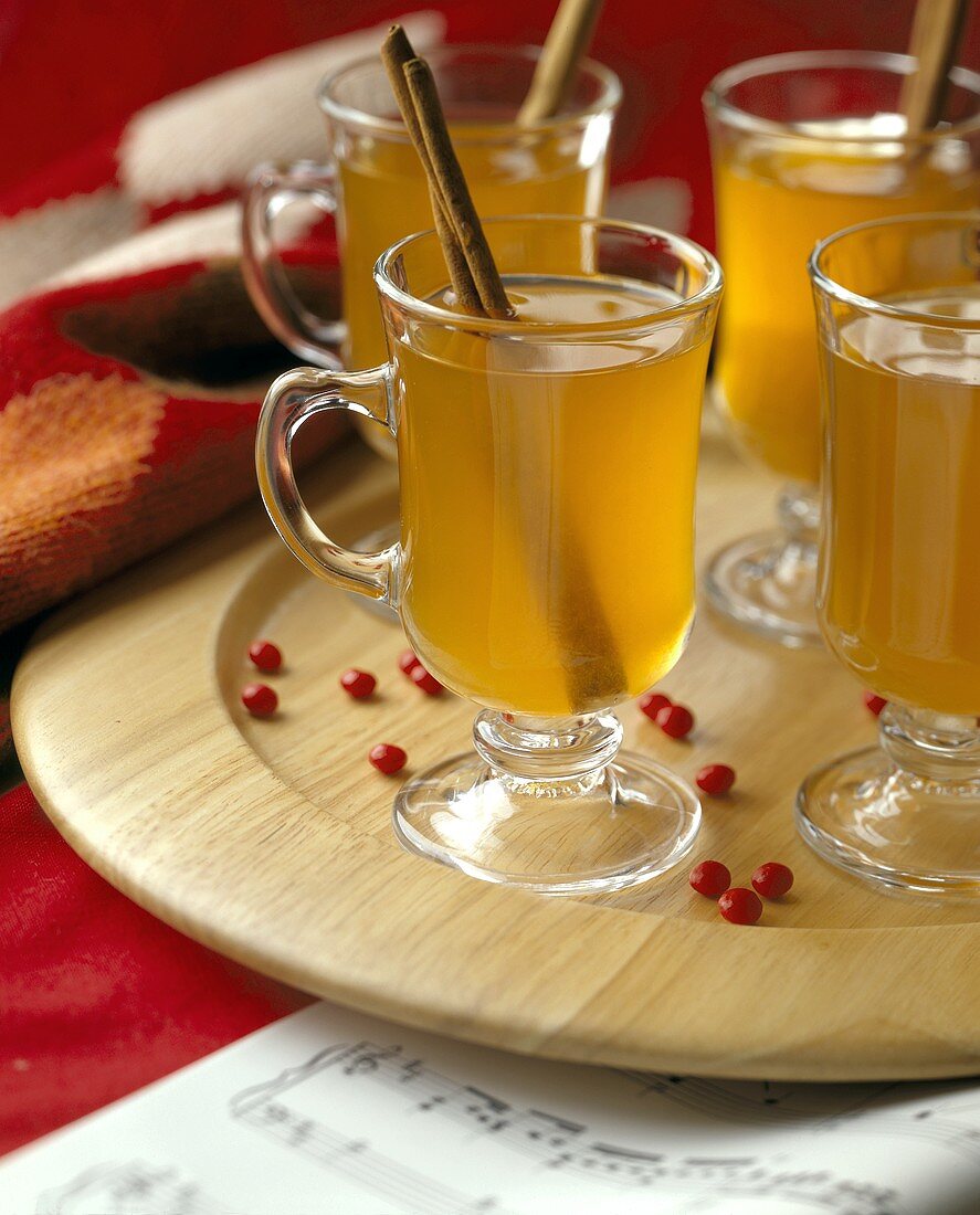 Hot Cider with Cinnamon Sticks in Glass Mugs
