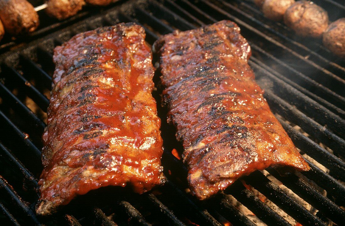 Two Racks of Baby Back Ribs on Grill