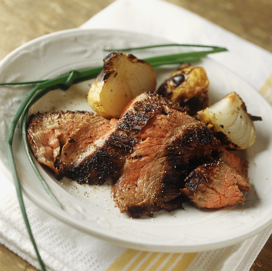 Strips of Flank Steak with Roasted Onions and Chives