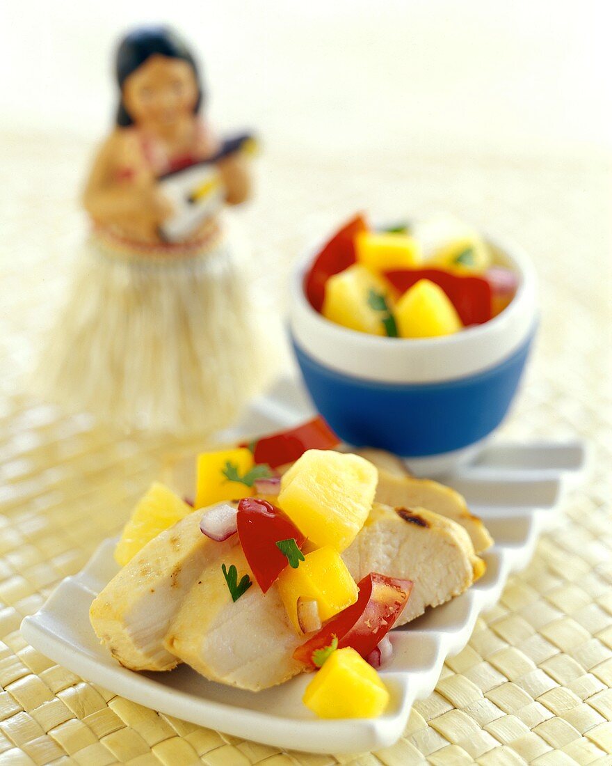 Sliced Chicken Breast with Mango Salsa; Hula Doll