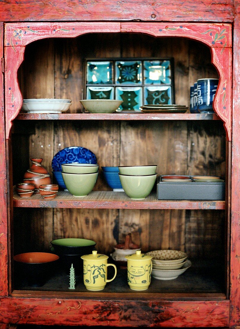 Chinese Cups and Bowls in Cabinet