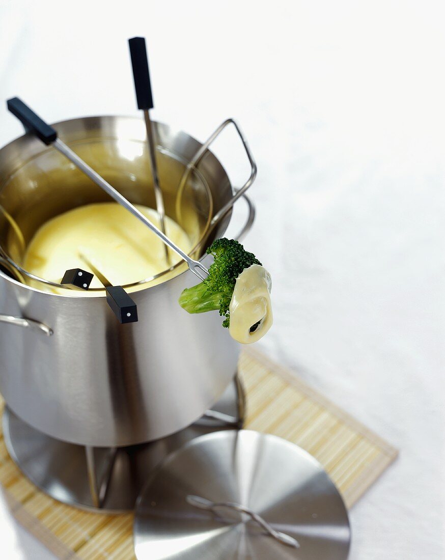 Cheese fondue with a broccoli floret