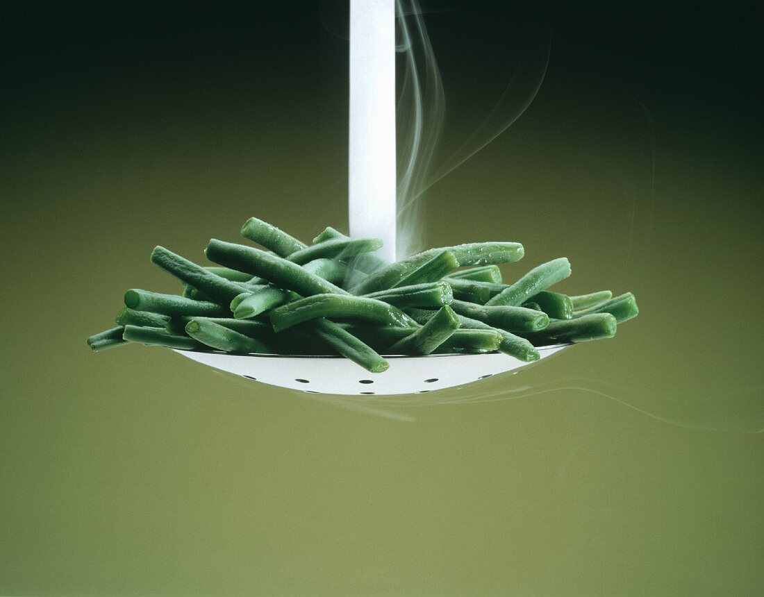 Steaming Cut Green Beans on Slotted Spoon