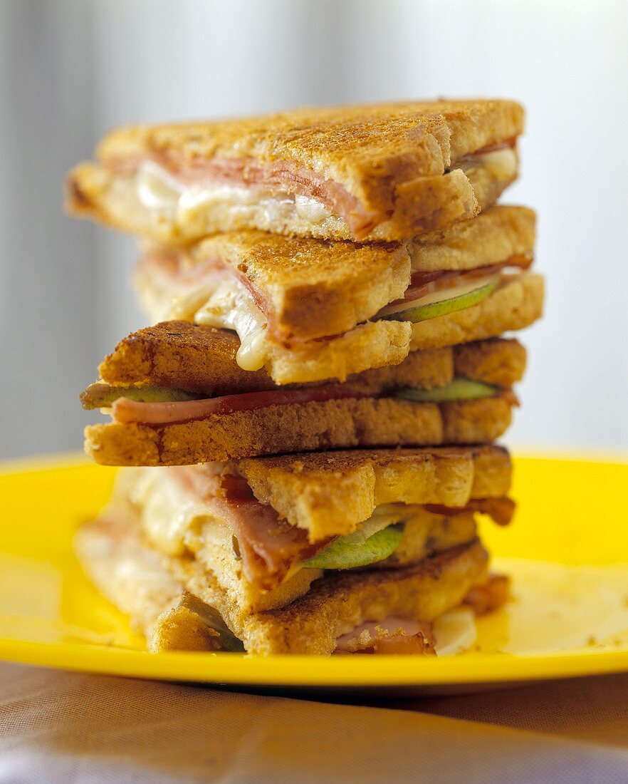 Ham and cheese on toast, in a pile