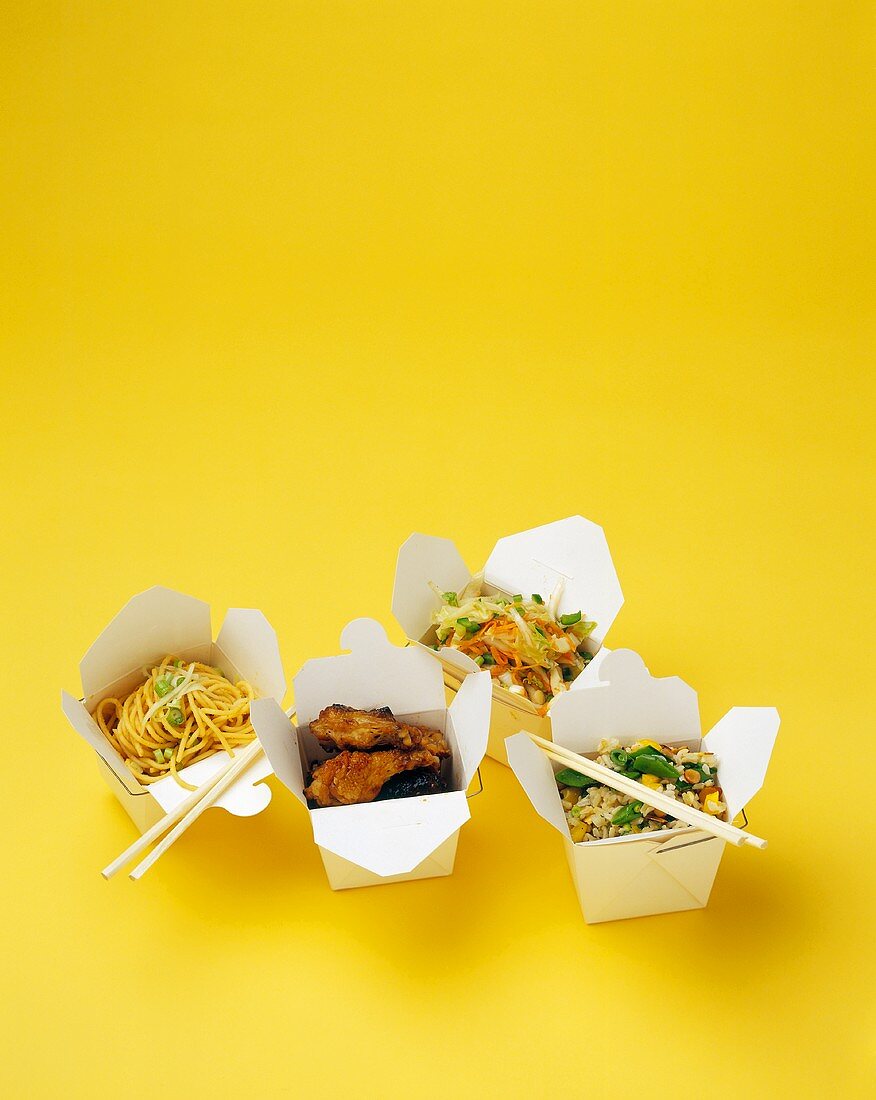 Four different Oriental take-away dishes