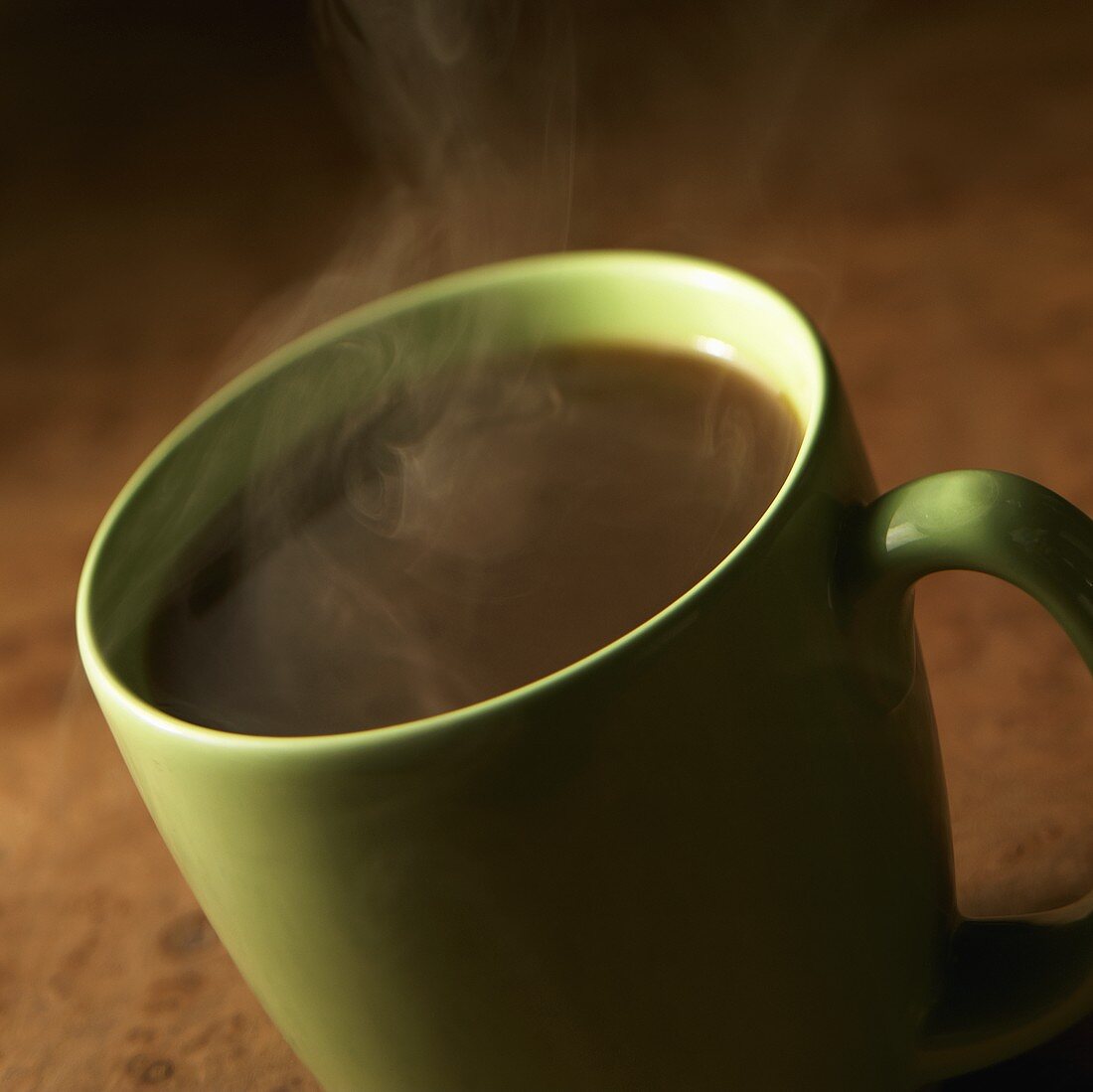 Steaming Black Coffee in a Green Mug