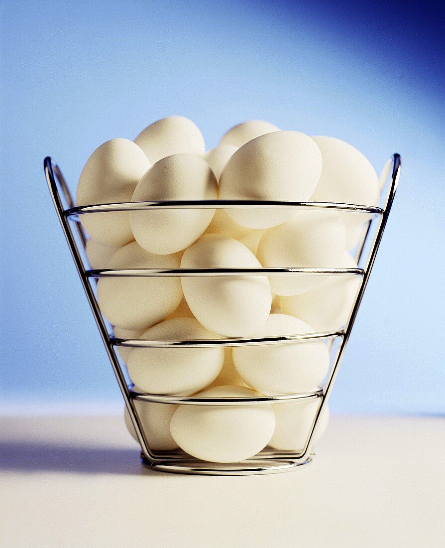 White eggs in a metal basket