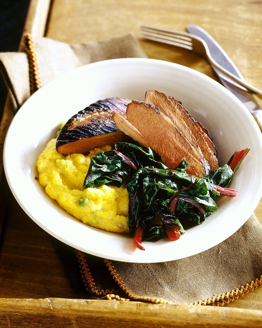 Barbecued duck breast with Swiss chard and polenta