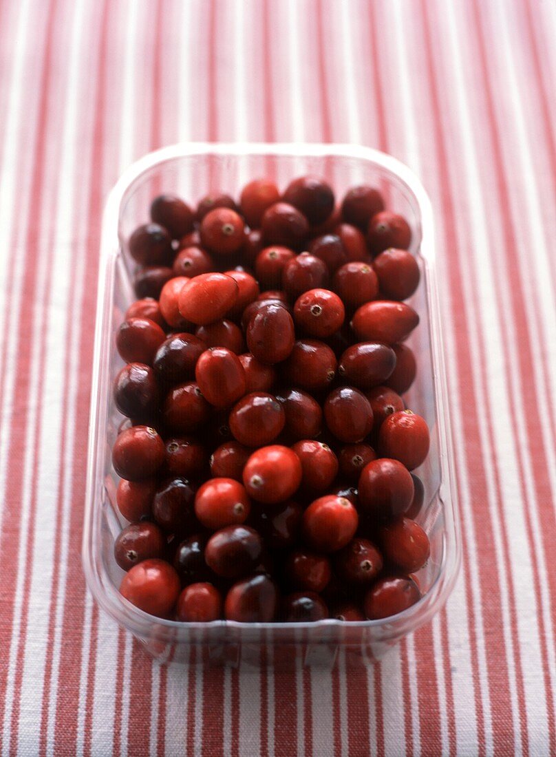 Cranberries in plastic container
