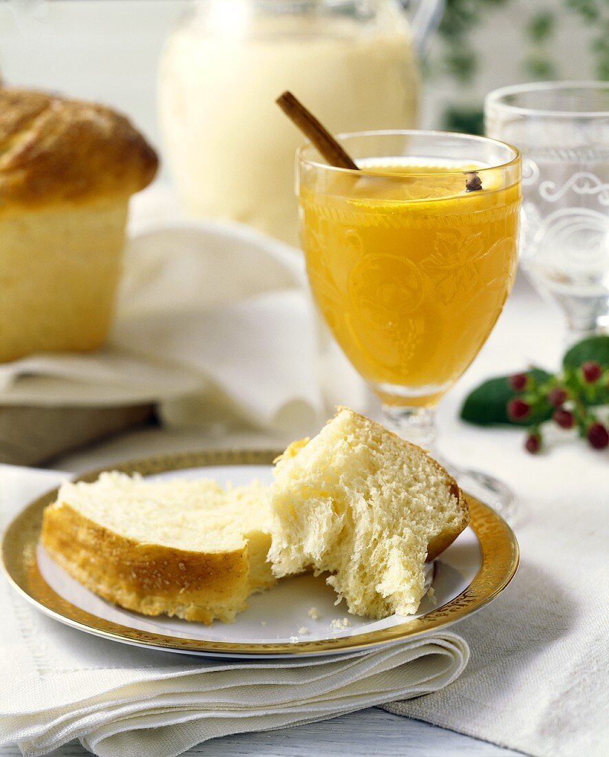 Brioche and glass of orange juice