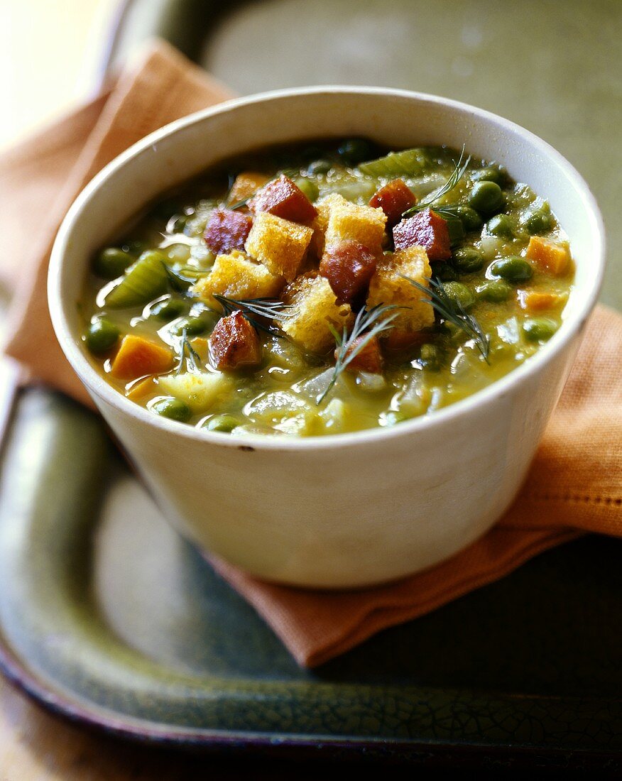 Pea soup with sausage and croutons