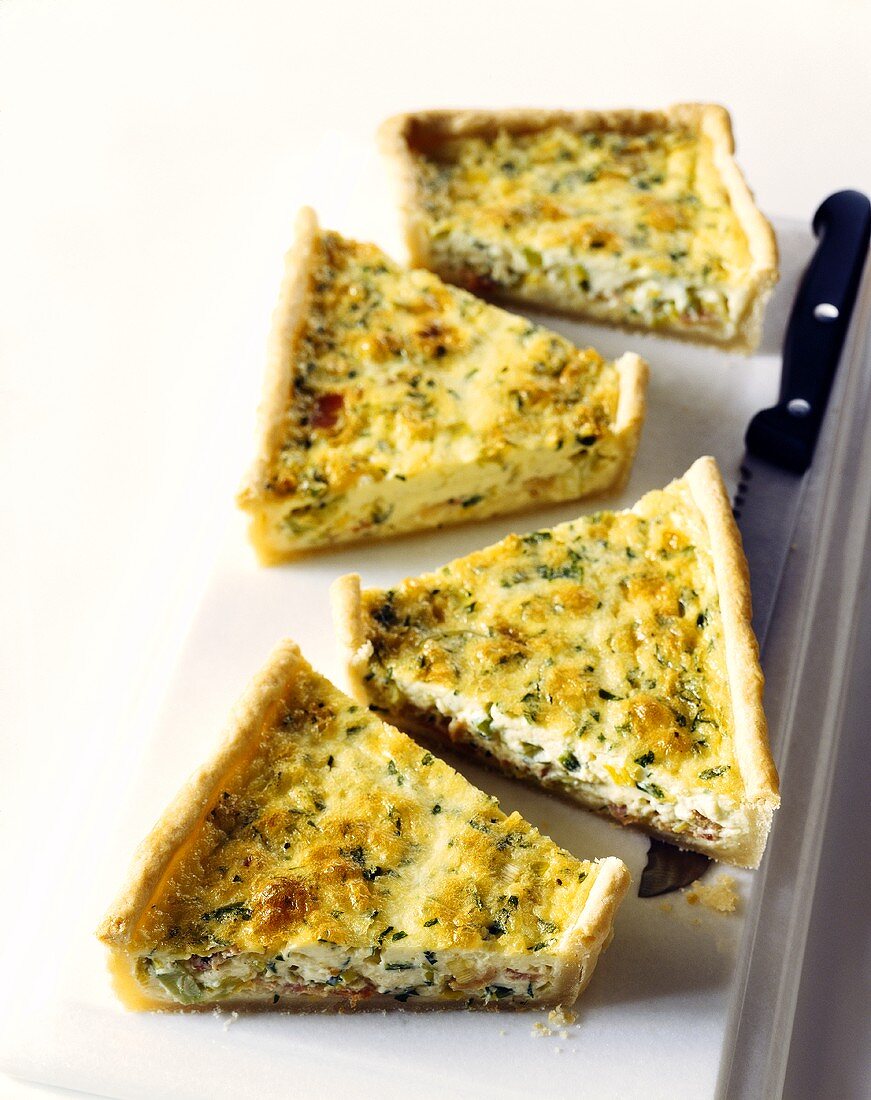 Four pieces of quiche lorraine