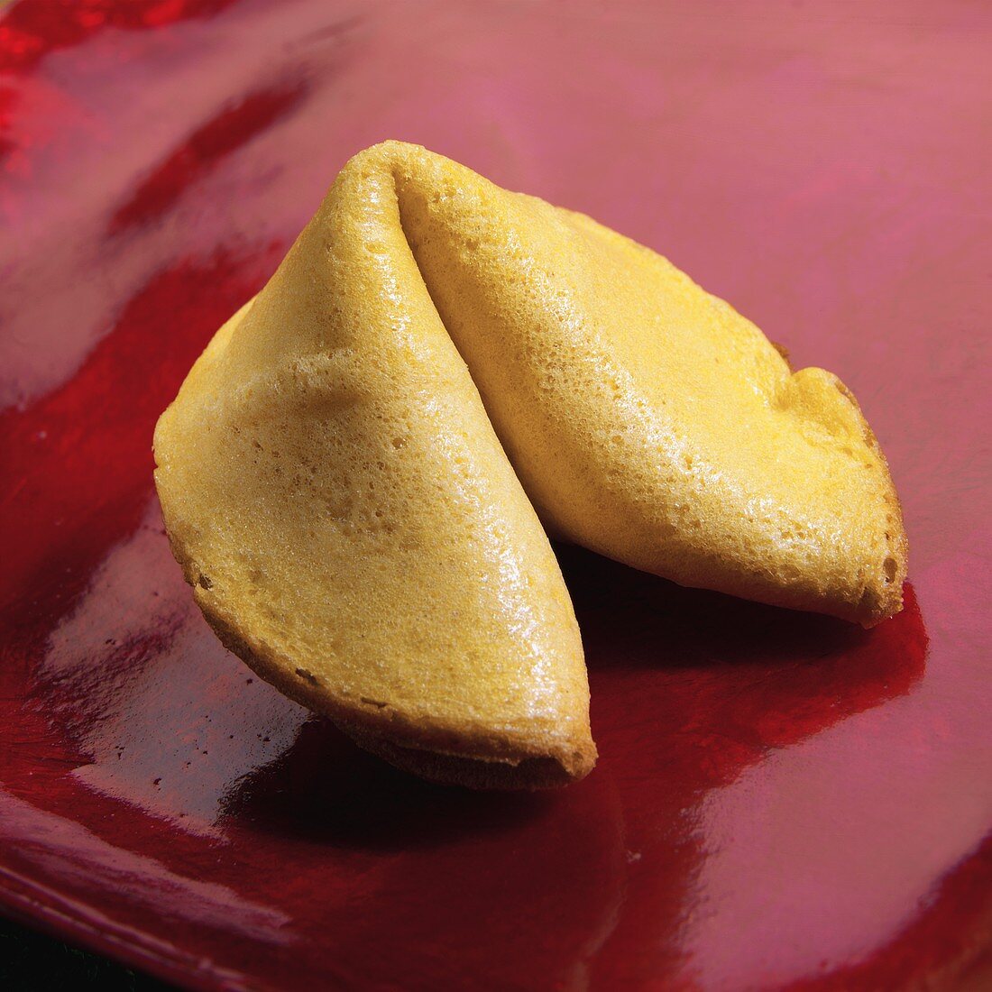 A Fortune Cookie on a Red Background