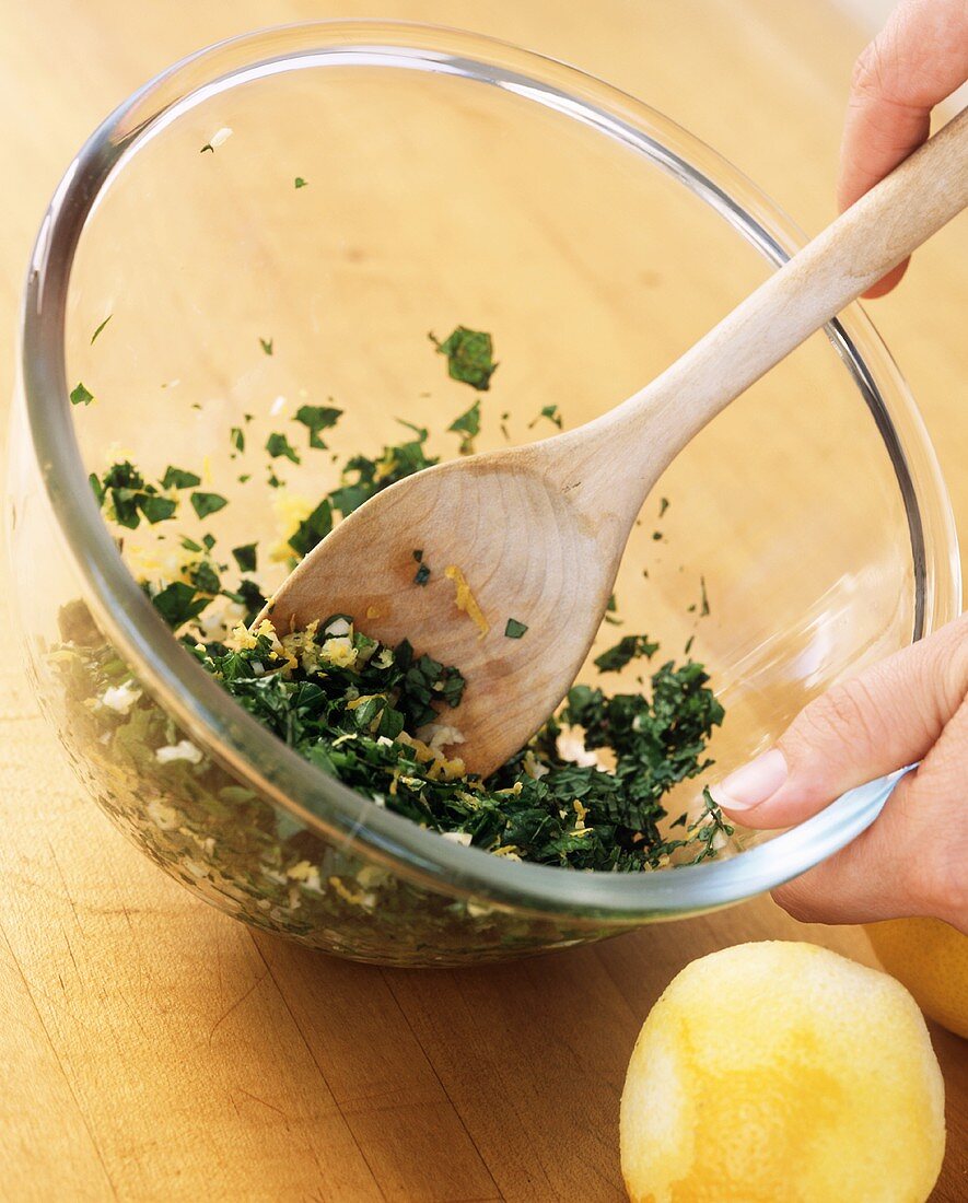 Parsley and lemon zest being mixed together