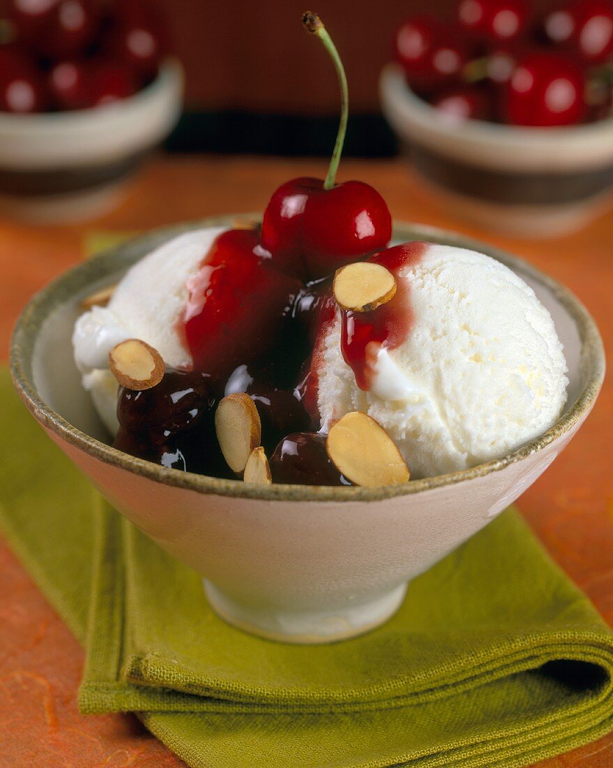 Vanilla Ice Cream with Cherry Sauce and Almonds