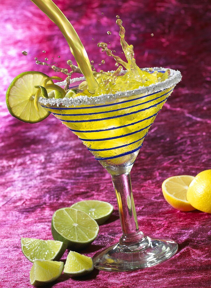 A Margarita Splashing into a Glass