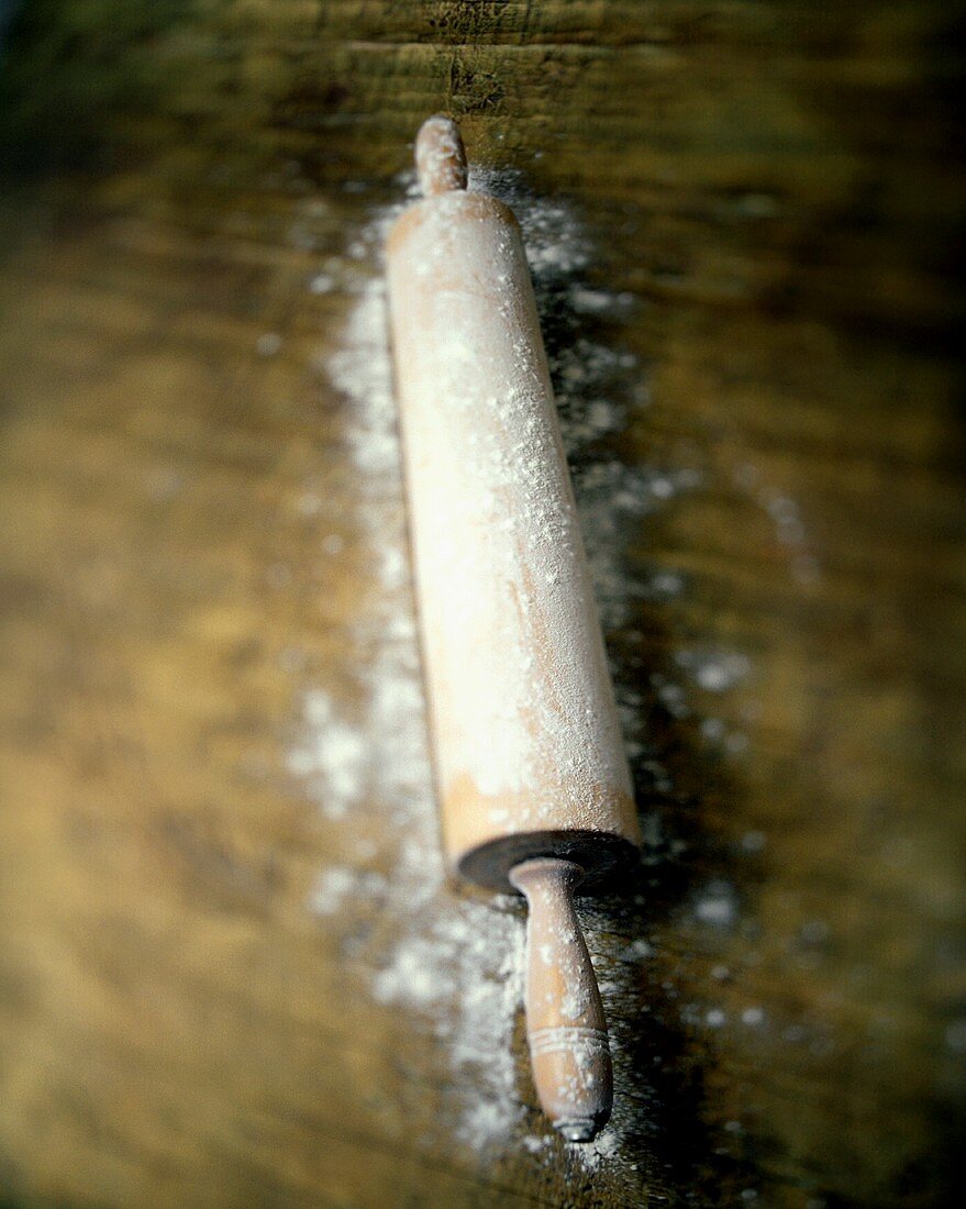 A Wooden Rolling Pin with Flour