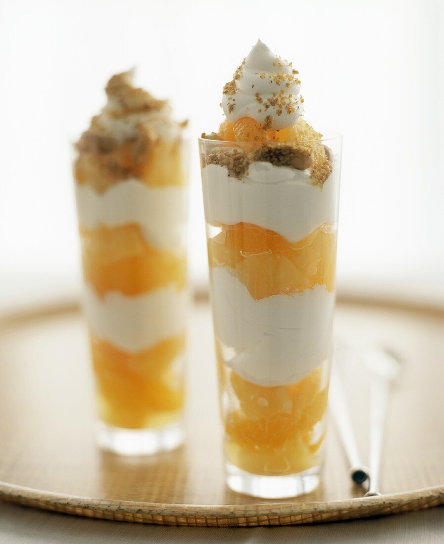 Two orange trifles in tall glasses