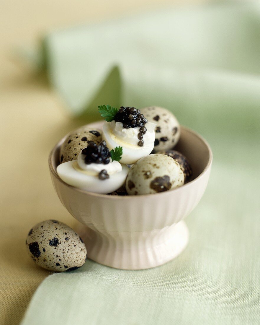 Boiled quails' eggs with caviar and crème fraîche