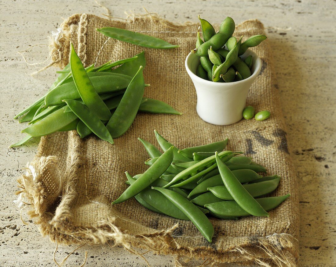 Snow Peas, Sugar Snap Peas and Soybeans on a Piece of Burlap