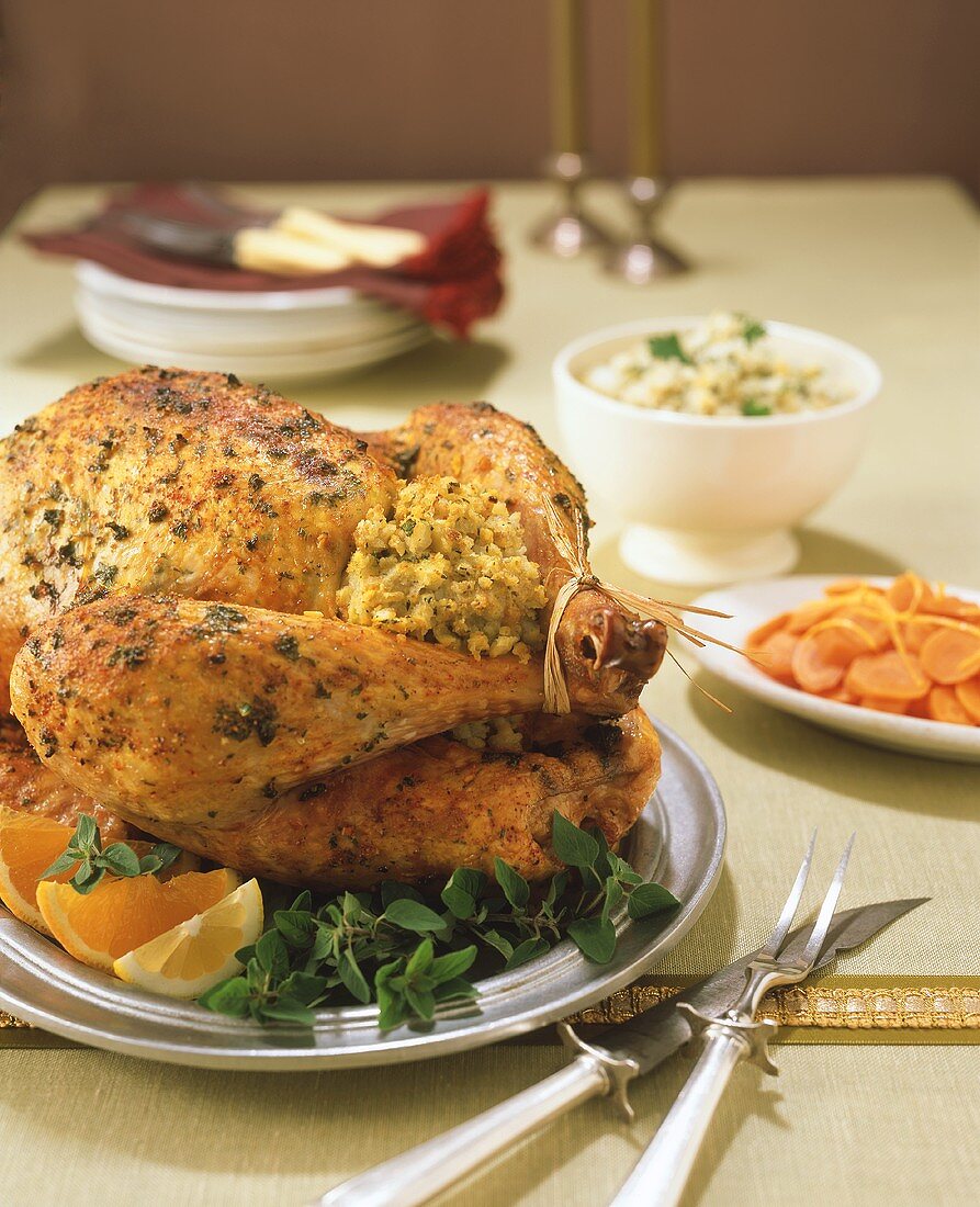 A Stuffed Turkey on the Table with Side Dishes