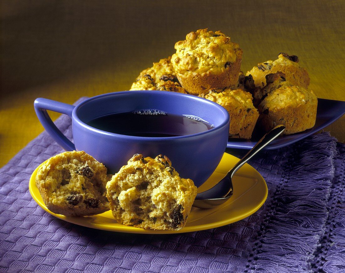 Raisin muffins and cup of black coffee