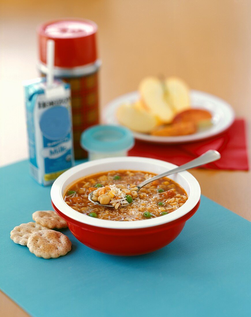 Hearty Alphabet Soup with Grated Parmesan, Crackers and Milk