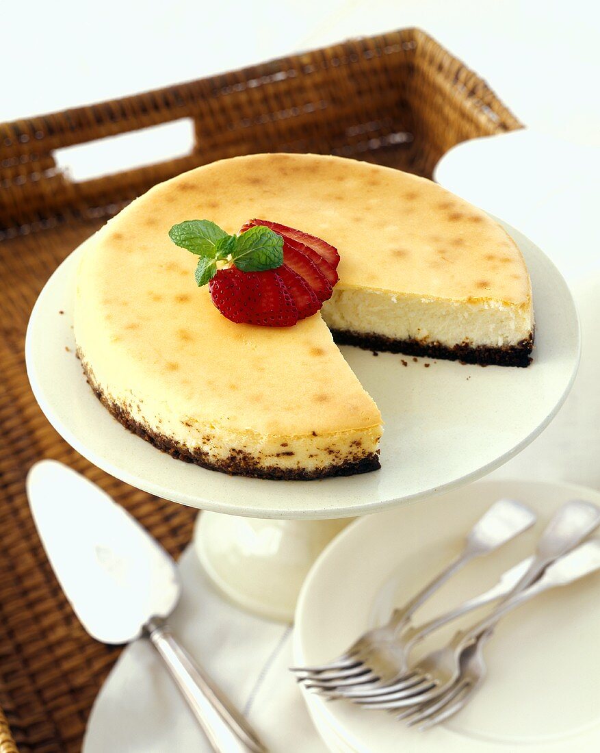 Cheesecake with Sliced Strawberries on a Cake Stand