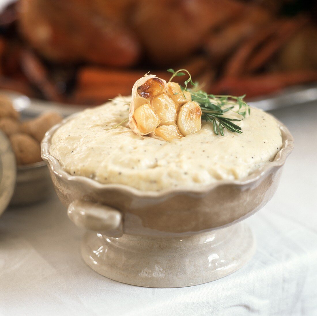 Mashed potato with fried garlic and rosemary