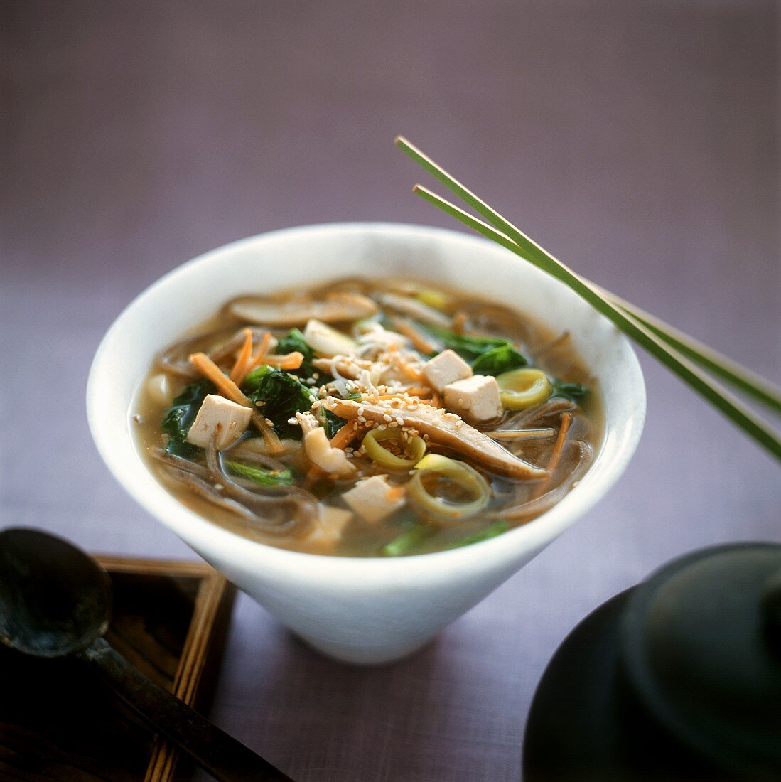 Sweet and sour soup with tofu, vegetables and sesame