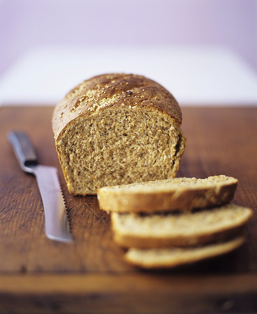 Wholemeal bread with sesame, slices cut