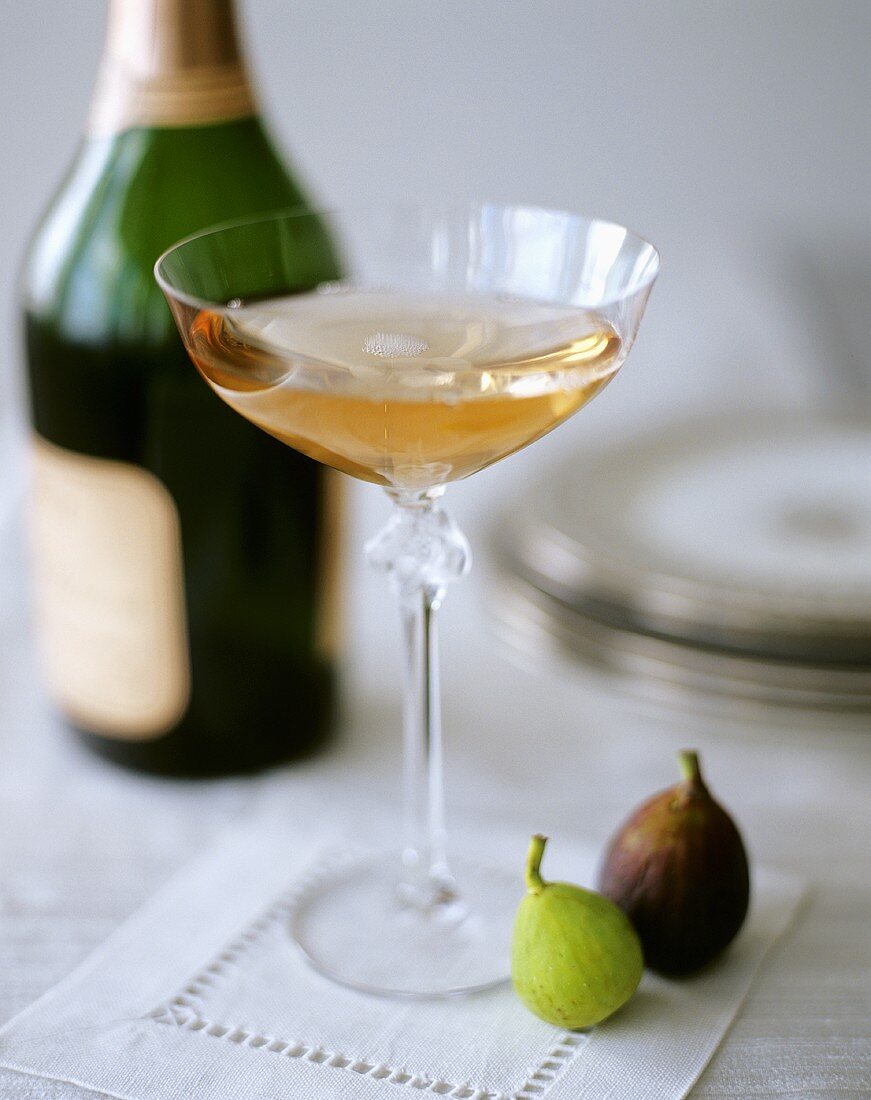A Glass of Pink Champagne with Figs