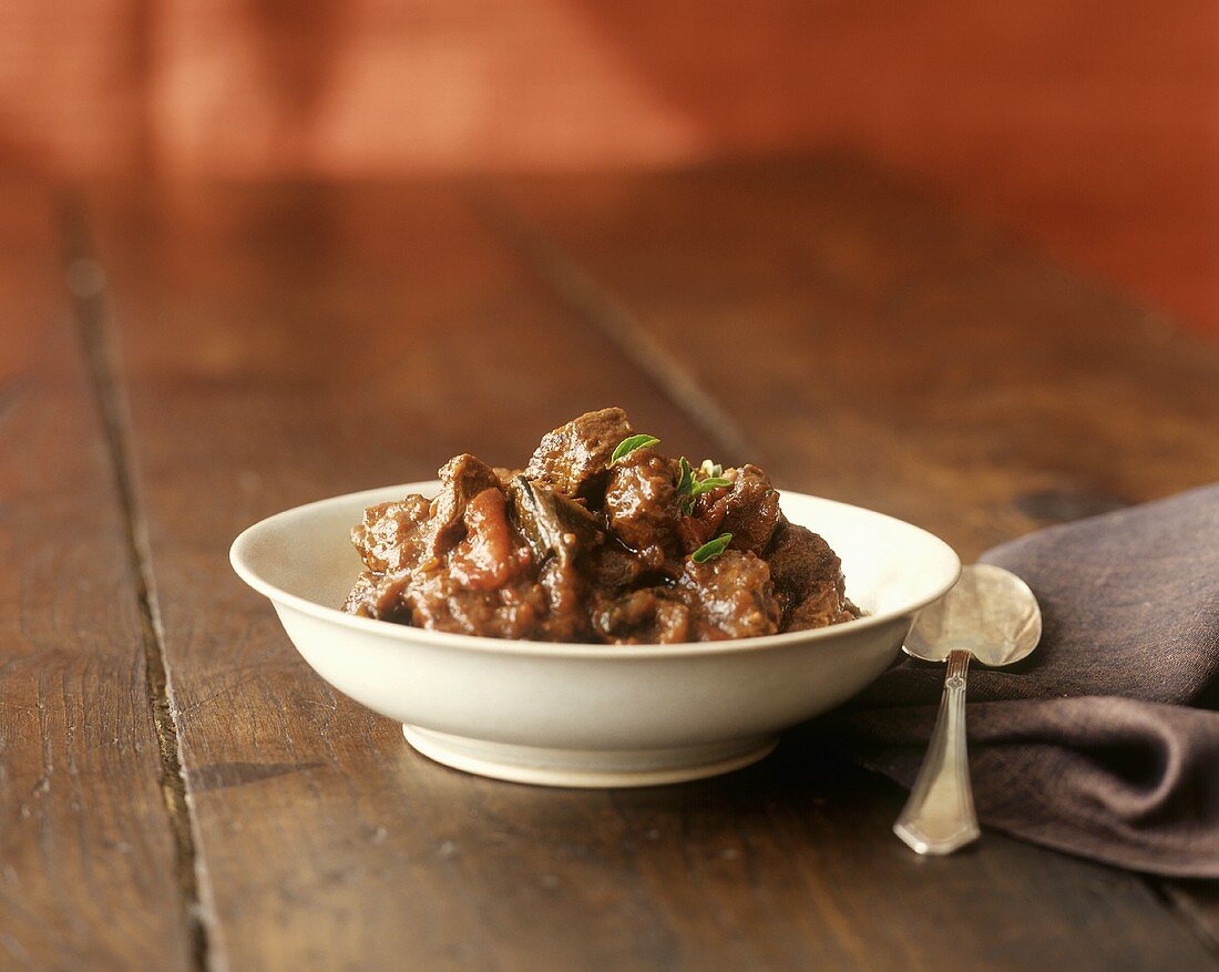 Beef ragout in white bowl