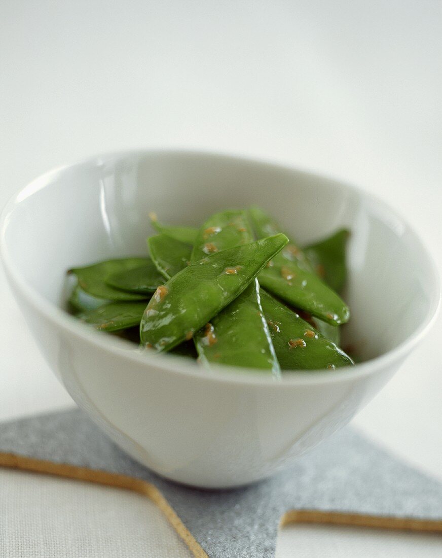 A Bowl of Snow Peas in Peanut Sauce on a Star