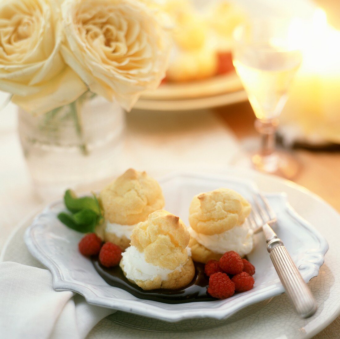 Cream Puffs with Raspberries in Chocolate Sauce