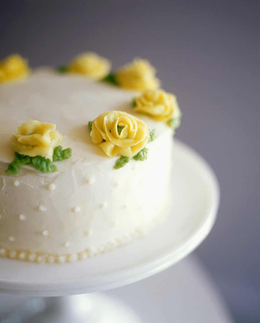 Birthday cake with yellow marzipan roses