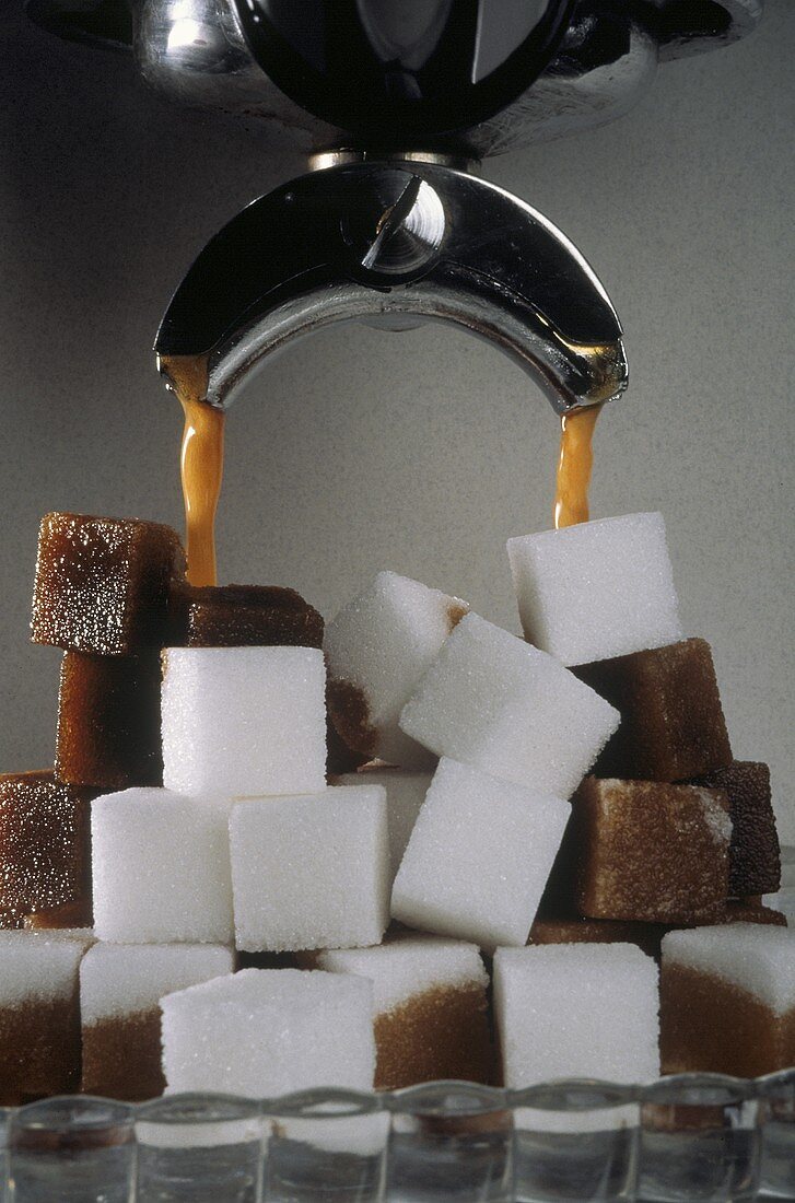 Coffee Pouring Over a Stack of Sugar Cubes