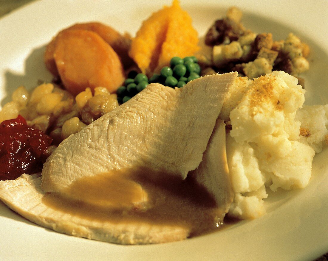 Sliced Thanksgiving Turkey with Vegetables on a Plate