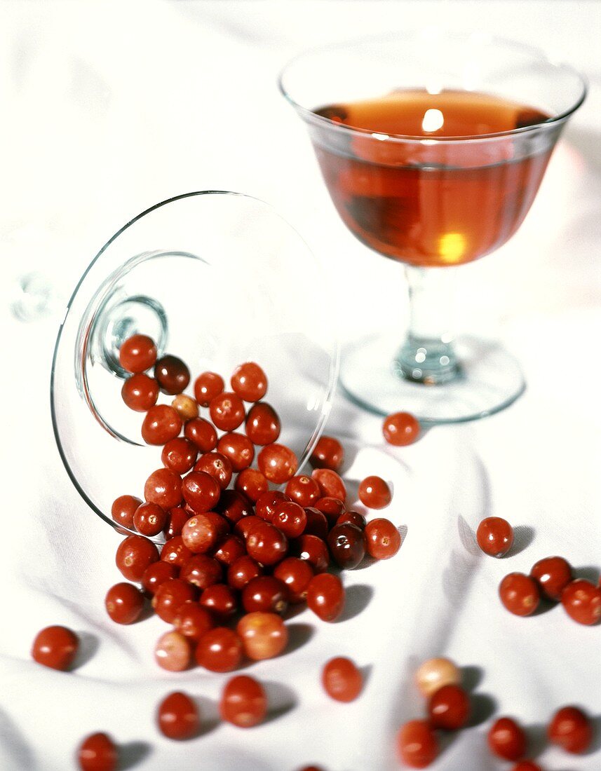 A Glass of Cranberries Spilling Over; Cranberry Juice