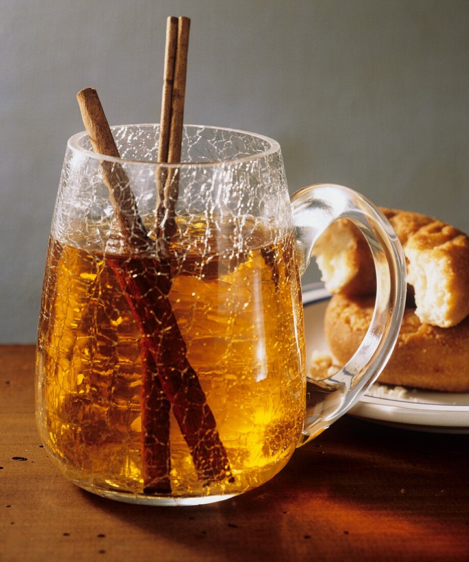 A Mug of Mulled Cider with Cinnamon Sticks