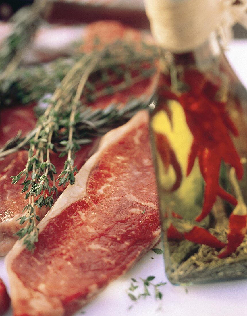 Sirloin Strips with Herbs; Bottle of Oil