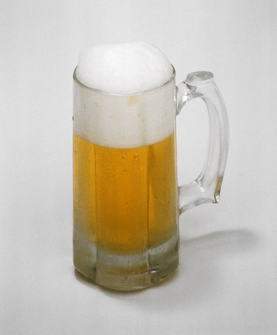 A Full Mug of Beer Foaming Over