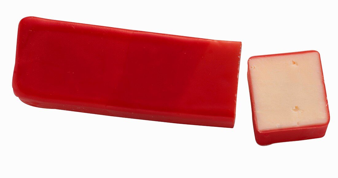 A Stick of Cheddar with Red Wax Coating