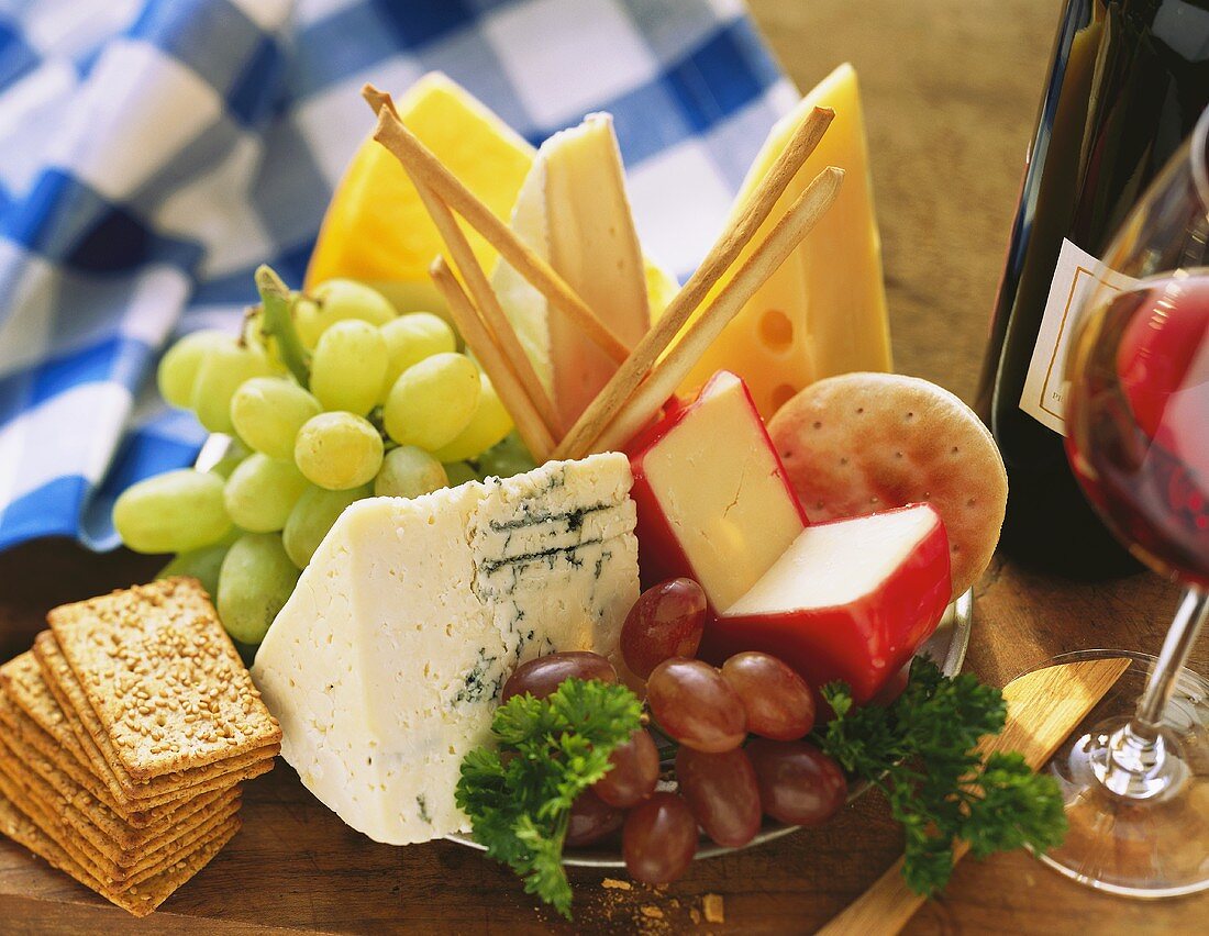 Assorted Cheese Crackers and Grapes; Wine