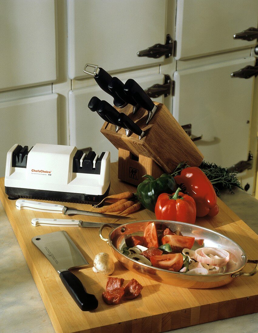 Kitchen Knives and Knife Sharpener with Ingredients