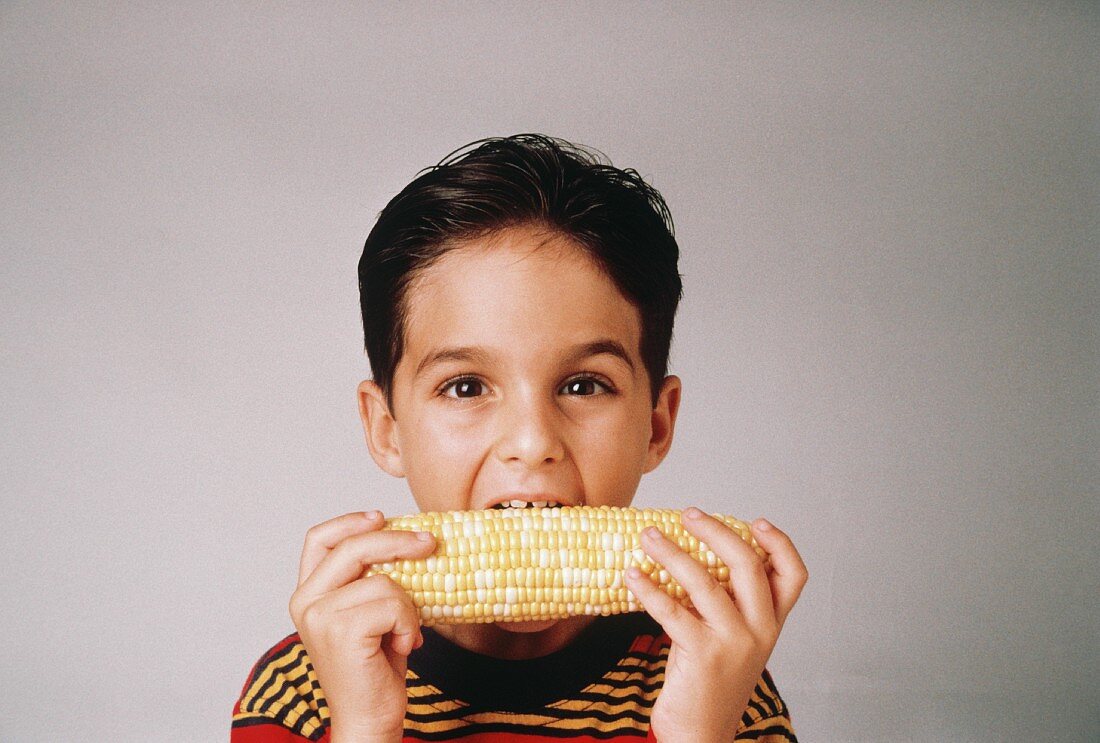 Boy Eating Corn on the Cob