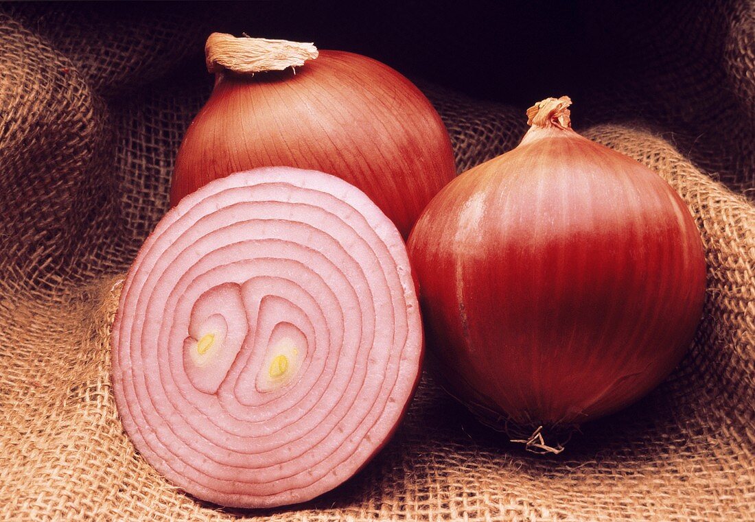 Two Whole Red Onions with a Half of an Onion